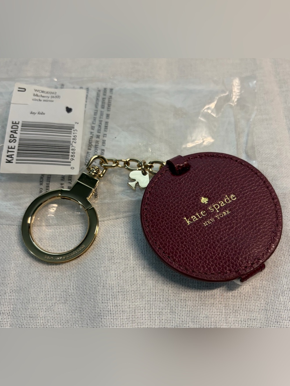 kate spade Round Burgundy Leather Key & Charm Holder with Gold Hardware & Mirror